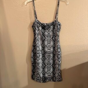 Black and white snake skin mini dress by Salty